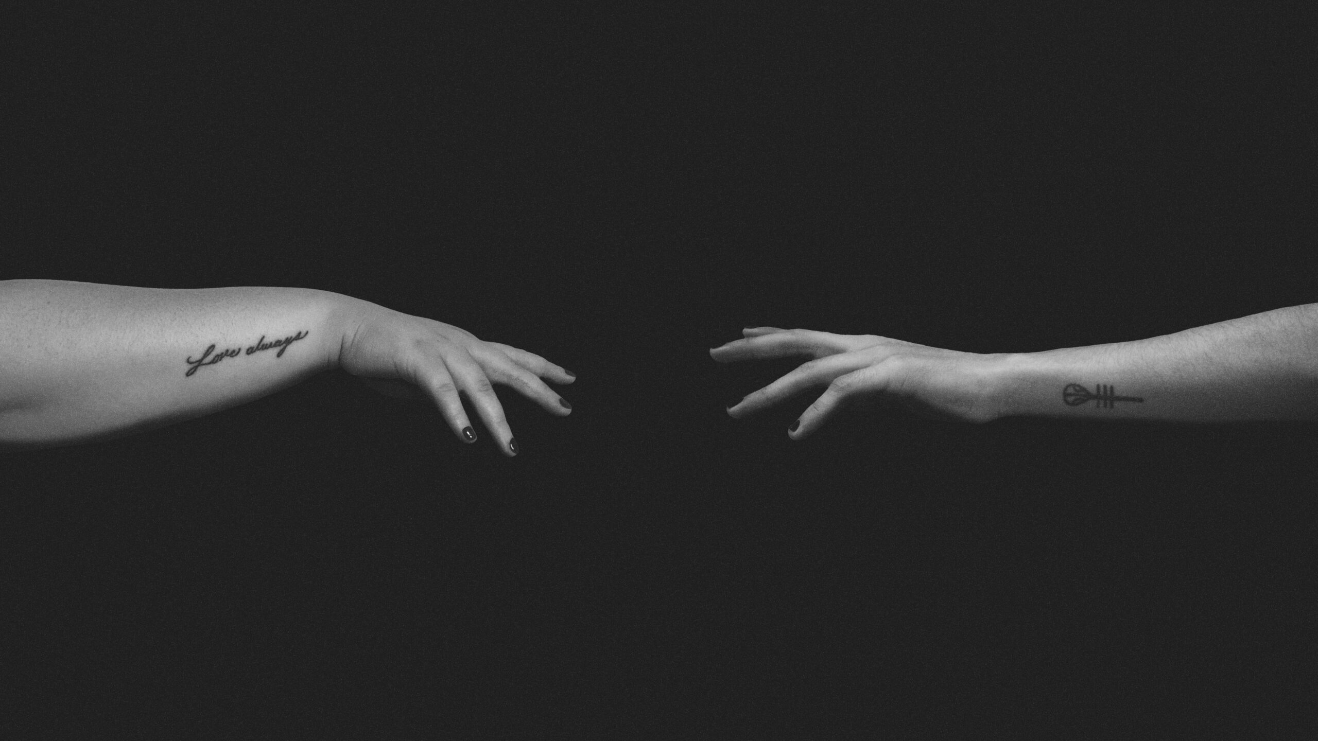 grayscale photo of persons hand